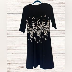 Maggy London for Melanie Lyne black  dress with white and silver flower appliqué
